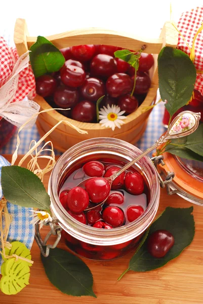 Jar of cherry compote — Stock Photo, Image