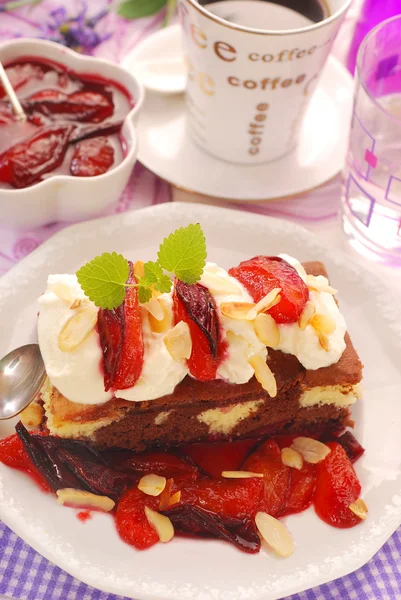 Homemade cake with plums and whipped cream — Stock Photo, Image