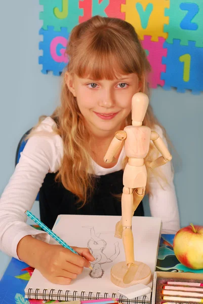Schoolgirl on drawing lesson — Stock Photo, Image