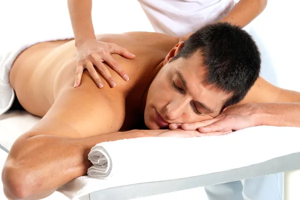 Hombre recibiendo masaje relajarse tratamiento primer plano de las manos femeninas Imágenes de stock libres de derechos
