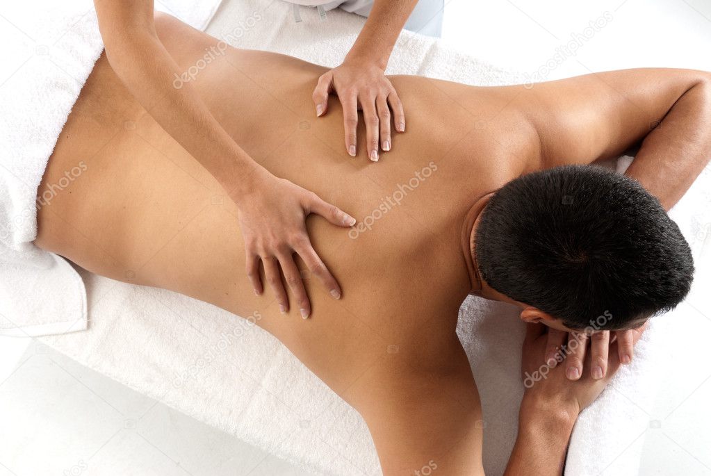Unrecognizable man receiving massage relax treatment close-up from female h
