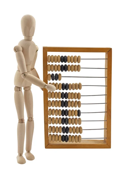 Wooden figure and old wooden abacus — Stock Photo, Image