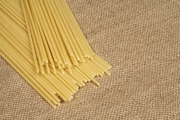Pasta on sacking — Stock Photo, Image
