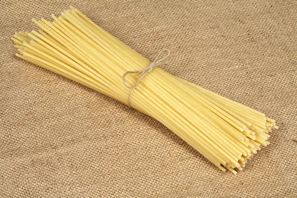 Pasta on sacking — Stock Photo, Image