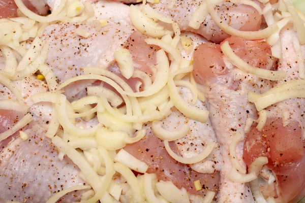 Close-up of fresh meat with onions — Stock Photo, Image