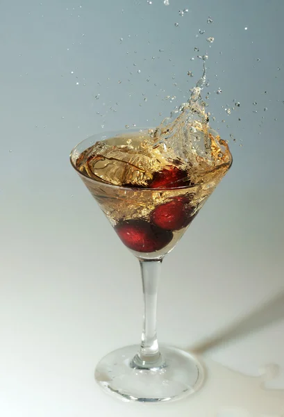 Cherry in a glass with champagne — Stock Photo, Image