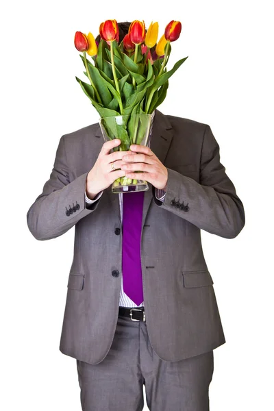 Férfi öltöny, nyakkendő, gazdaság, elszigetelt fehér tulipán virág — Stock Fotó