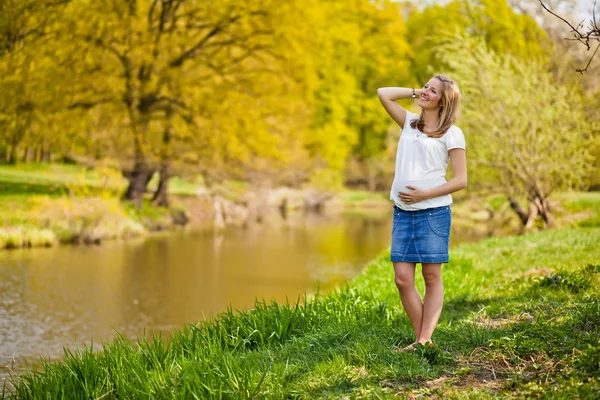 stock image Pregnant woman outdoor spring time