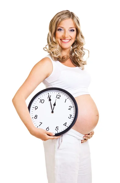 Pregnant woman with clock isolated on white Stock Photo
