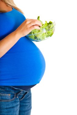 hamile kadın üzerinde beyaz izole sebzeli