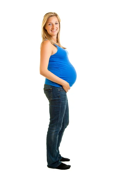 Mujer embarazada aislada en camisa blanca en azul — Foto de Stock
