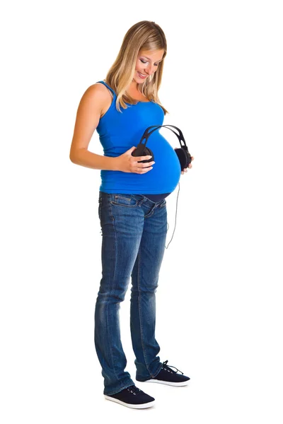 Schwangere mit Kopfhörern isoliert auf weiß — Stockfoto