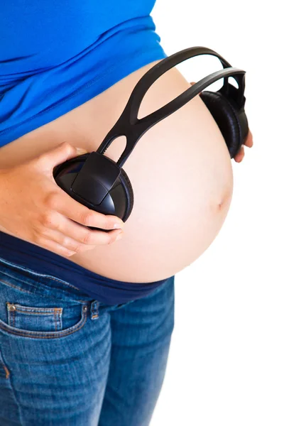 孕妇用耳机上白色隔离 — 图库照片