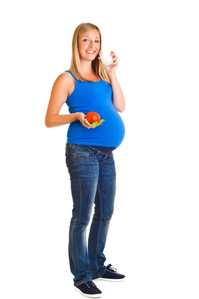 Donna incinta con verdure, isolata su bianco — Foto Stock