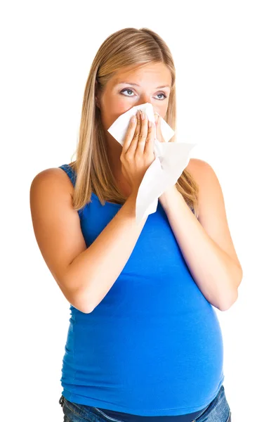 Mujer embarazada limpiando la nariz aislada en blanco — Foto de Stock