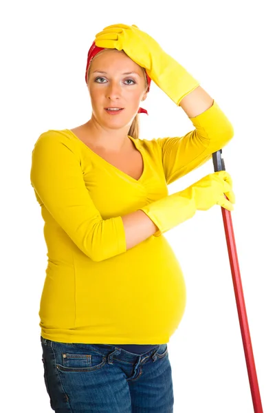 Tired pregnant woman cleaning the floor isolated on white — Stock Photo, Image