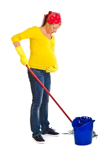 Mujer embarazada cansada limpiando el suelo aislado en blanco —  Fotos de Stock