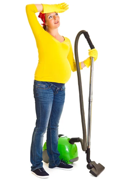 Pregnant woman clean with vacuum cleaner isolated on white — Stock Photo, Image