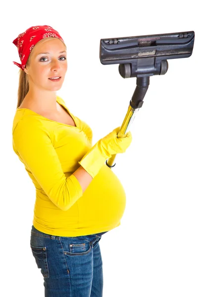 Pregnant woman clean with vacuum cleaner isolated on white — Stock Photo, Image