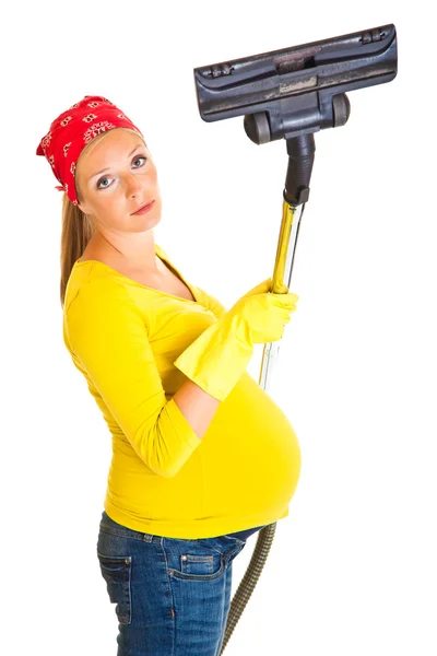 Mujer embarazada limpia con aspiradora aislada en blanco —  Fotos de Stock
