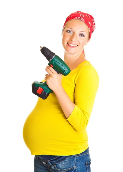 Mulher grávida com ferramentas elétricas isoladas em branco — Fotografia de Stock
