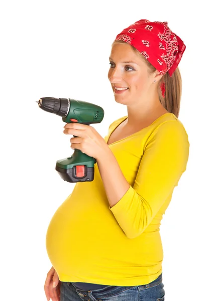 Mulher grávida com ferramentas elétricas isoladas em branco — Fotografia de Stock