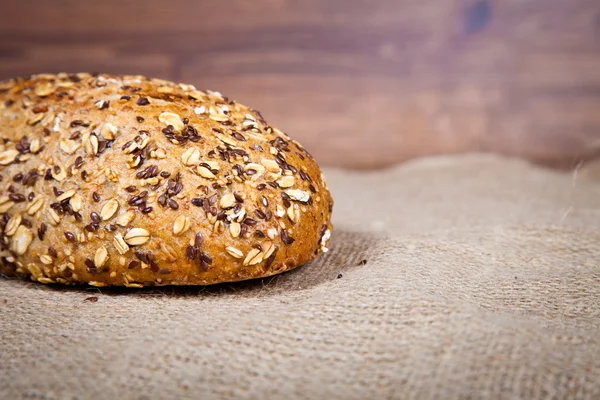 stock image Composition of fresh bread on wood