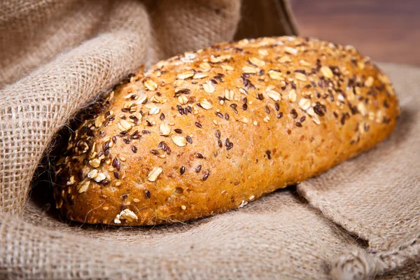 stock image Composition of fresh bread on wood