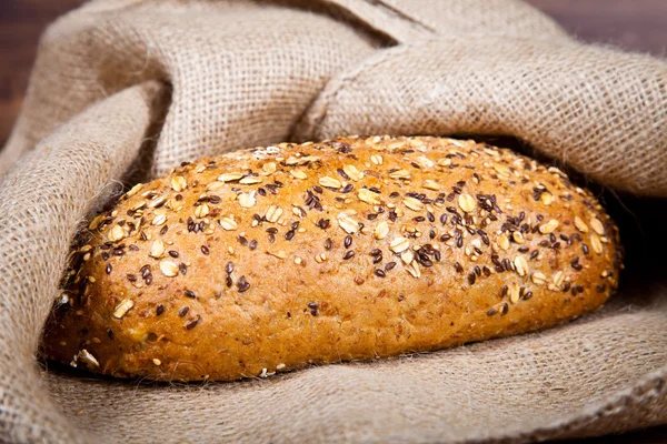 stock image Composition of fresh bread on wood