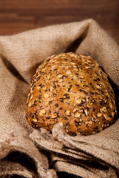 stock image Composition of fresh bread on wood