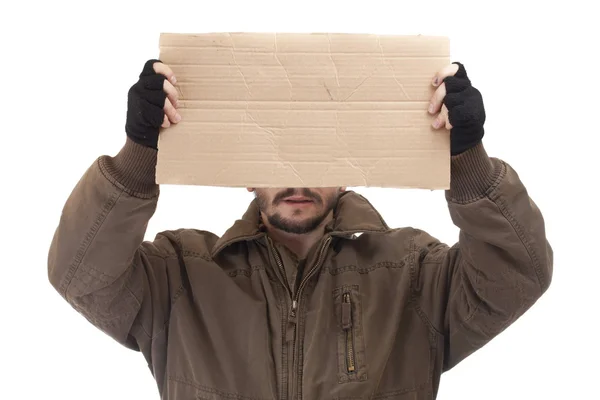 Mendigo sosteniendo el cartón — Foto de Stock