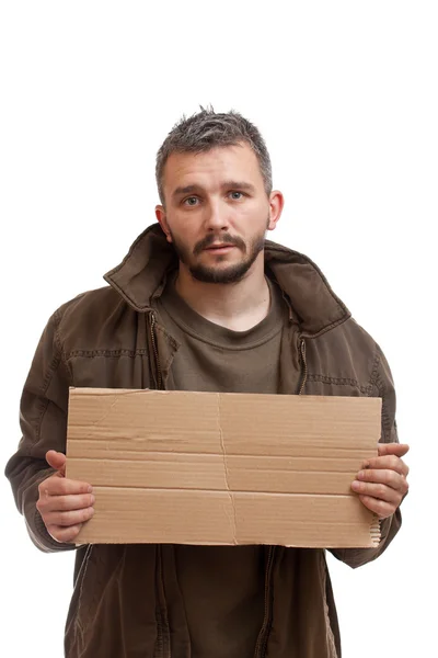 Mendigo sosteniendo el cartón — Foto de Stock