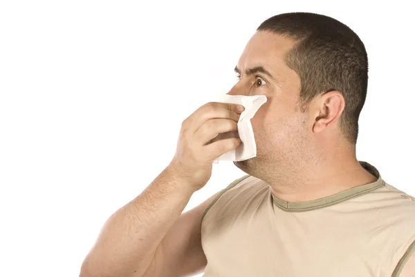 Hombre sonándose la nariz — Foto de Stock