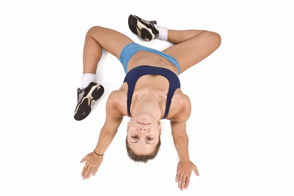 Flickan gör fitness övningar — Stockfoto
