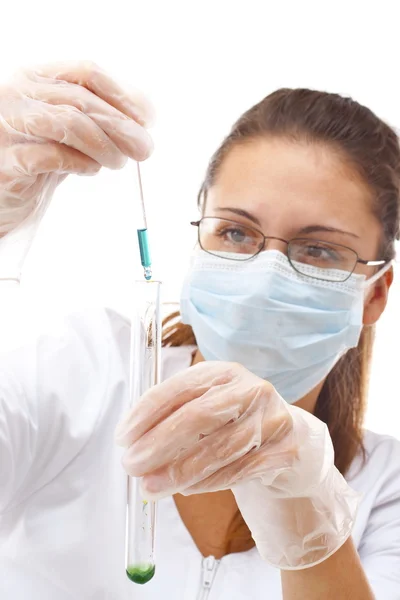 Female chemist using test tubes Stock Image