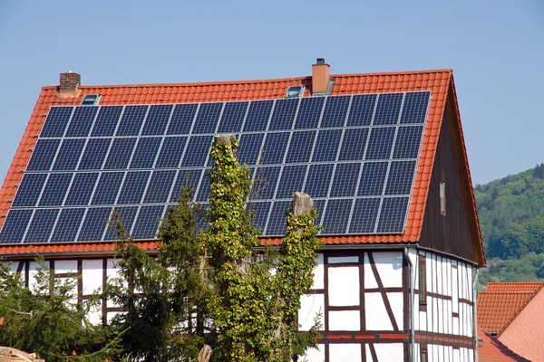 Solar panels on an old timbered house — Stock Photo, Image