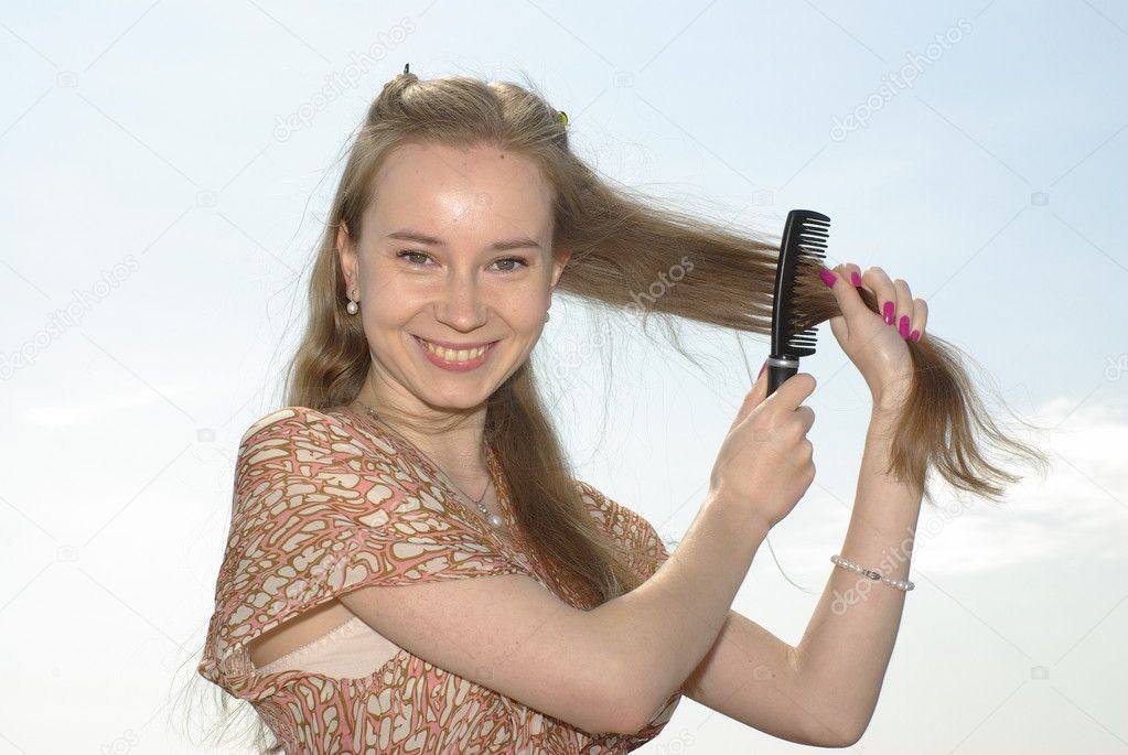 Girl combing her hair