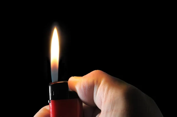 Aansteker in de hand — Stockfoto