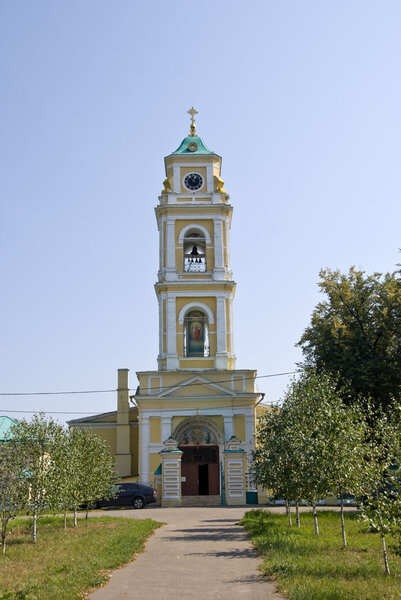 The bell tower with a clock in the Russian province
