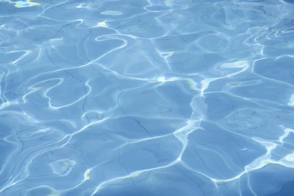 Swimming pool ripples water background — Stock Photo, Image
