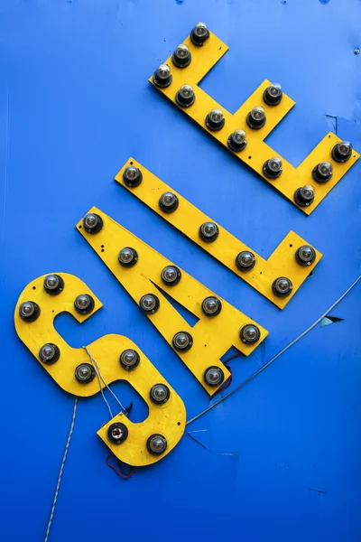 Yellow plastic sale sign — Stock Photo, Image