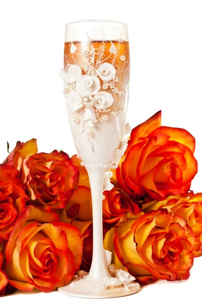 Glass of champagne with flowers — Stok fotoğraf