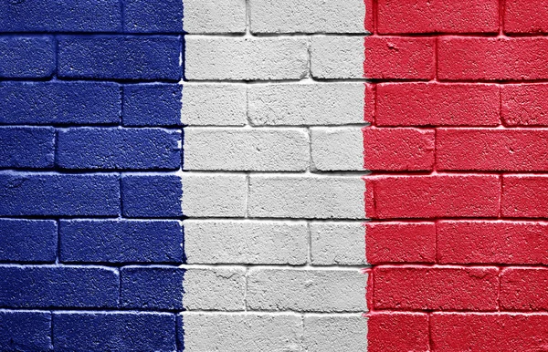 Σημαία της Γαλλίας στον τοίχο από τούβλα — Φωτογραφία Αρχείου