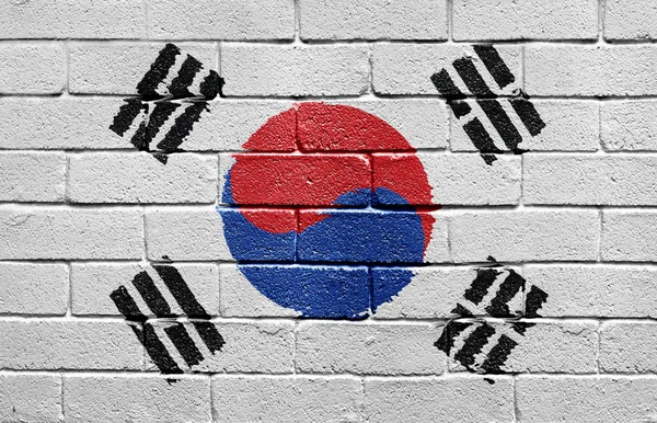 韩国国旗挂在砖墙上 — 图库照片