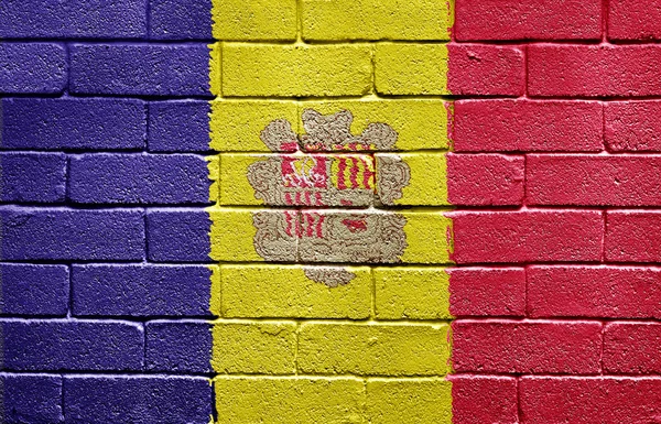 Andorra bayrağı tuğla duvar — Stok fotoğraf