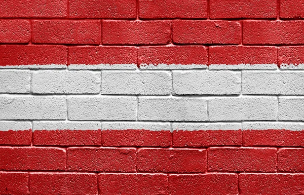 Σημαία της Αυστρίας σε έναν τοίχο από τούβλα — Φωτογραφία Αρχείου