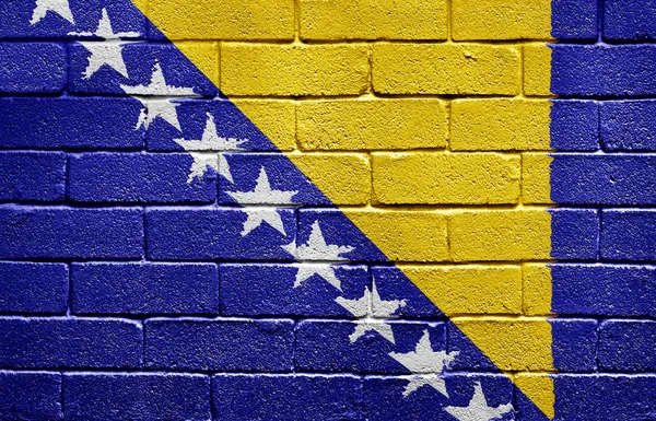 Σημαία της Βοσνίας και Ερζεγοβίνης στον τοίχο από τούβλα — Φωτογραφία Αρχείου