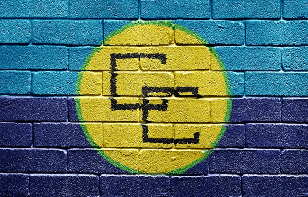 レンガの壁にカリブ コミュニティの旗 — ストック写真