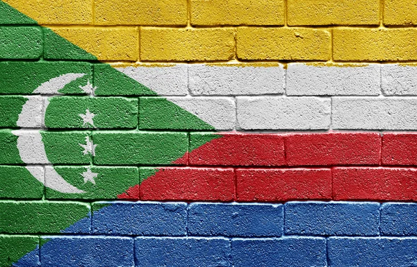 Flaggan på Komorerna på tegelvägg — Stockfoto