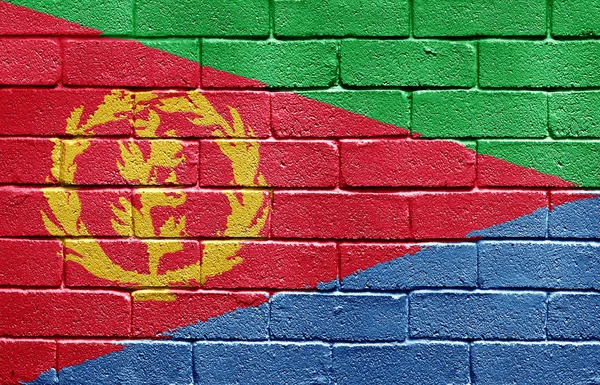 Flaggan av eritrea på tegelvägg — Stockfoto